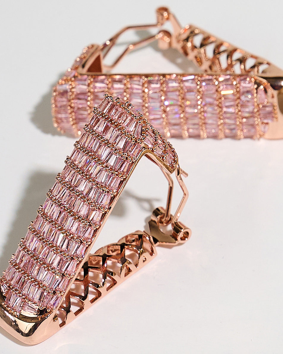 Detailed view of the 5A cubic zirconia and rhodium plating on the Trinity Hoop Earrings. Durable, hypoallergenic statement jewelry for women becoming their boldest selves.